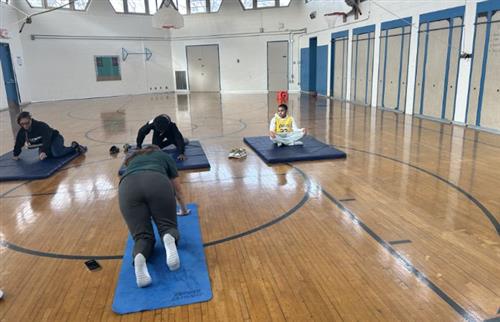  Students and staff working out in gym